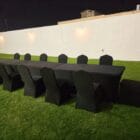 Black chairs and long tables for rental purpose in dubai