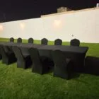 Black chairs and long tables for rental purpose in dubai