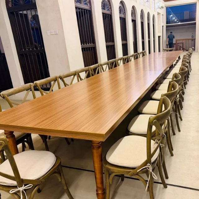 cross back chair with wooden table for rental purpose